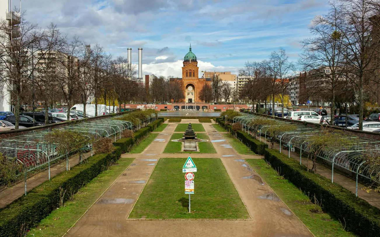 Kreuzberg park with pathways and a central fountain, Berlin.