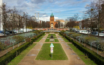 Kreuzberg park with pathways and a central fountain, Berlin.