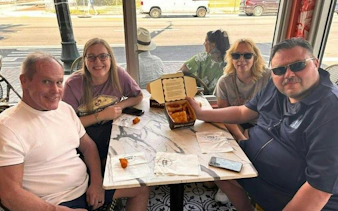 Group enjoying Cuban pastries at a café during Little Havana Walking Tour, Miami.