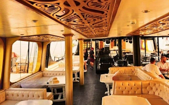 Interior of GONSTER Deluxe Pirate Boat with seating and passengers, Kemer tour.