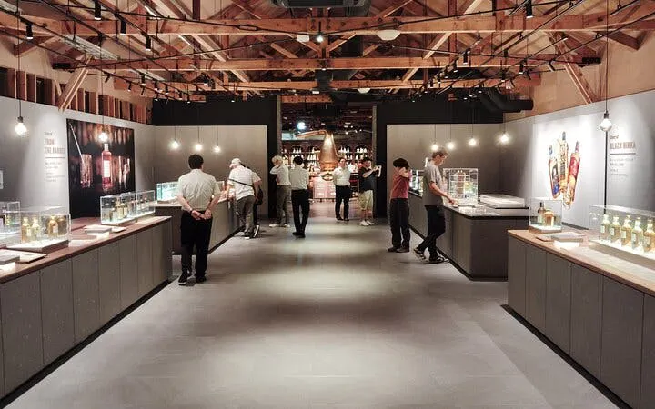 Yoichi distillery visitors exploring whisky exhibits at Nikka’s historic coastal site.
