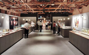 Yoichi distillery visitors exploring whisky exhibits at Nikka’s historic coastal site.