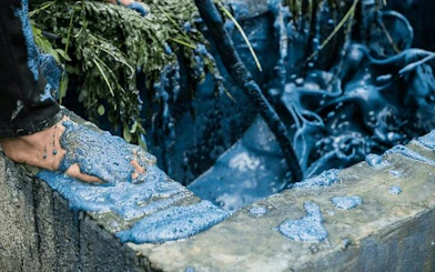 Hand dyeing fabric with indigo in Ta Van Village, Sa Pa, with H’Mong artisan.
