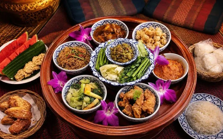 Traditional Thai dishes served on a Khantoke tray at Khum Khantoke, Chiang Mai.