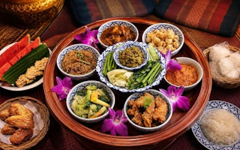 Traditional Thai dishes served on a Khantoke tray at Khum Khantoke, Chiang Mai.