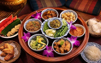 Traditional Thai dishes served on a Khantoke tray at Khum Khantoke, Chiang Mai.