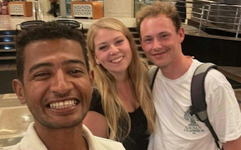 Tourists smiling with guide during private tour in Hurghada shopping area.