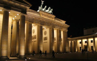 Brandenburg Gate illuminated at night, Berlin Wall walking tour.