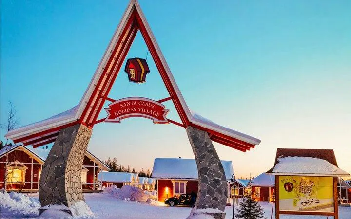 Santa Claus Village entrance in snowy Rovaniemi, Finland.