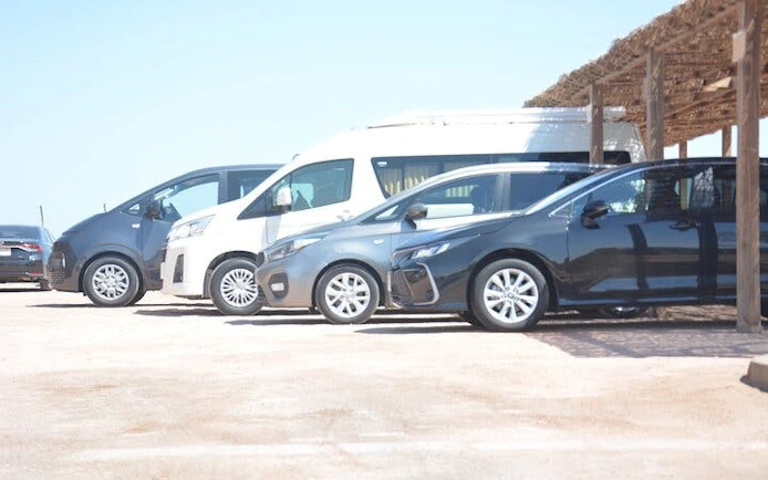 Airport transfer vehicles parked in Hurghada for hotel service.