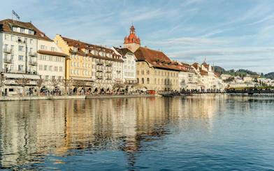 Riverside view of historic buildings in Lucerne Old Town, Switzerland.