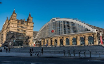 Liverpool Lime Street Station facade with historic architecture, part of Haunted Liverpool exploration game.