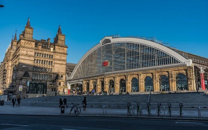 Liverpool Lime Street Station facade with historic architecture, part of Haunted Liverpool exploration game.