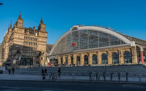 Liverpool Lime Street Station facade with historic architecture, part of Haunted Liverpool exploration game.