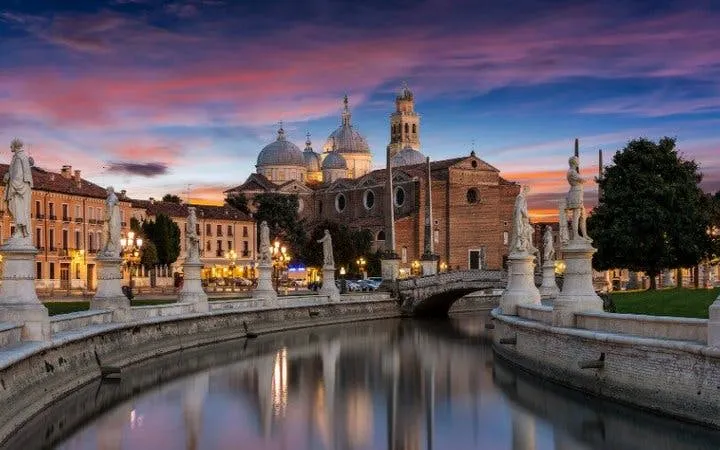 Prato della Valle canal and Basilica of Saint Anthony at sunset, Padua.