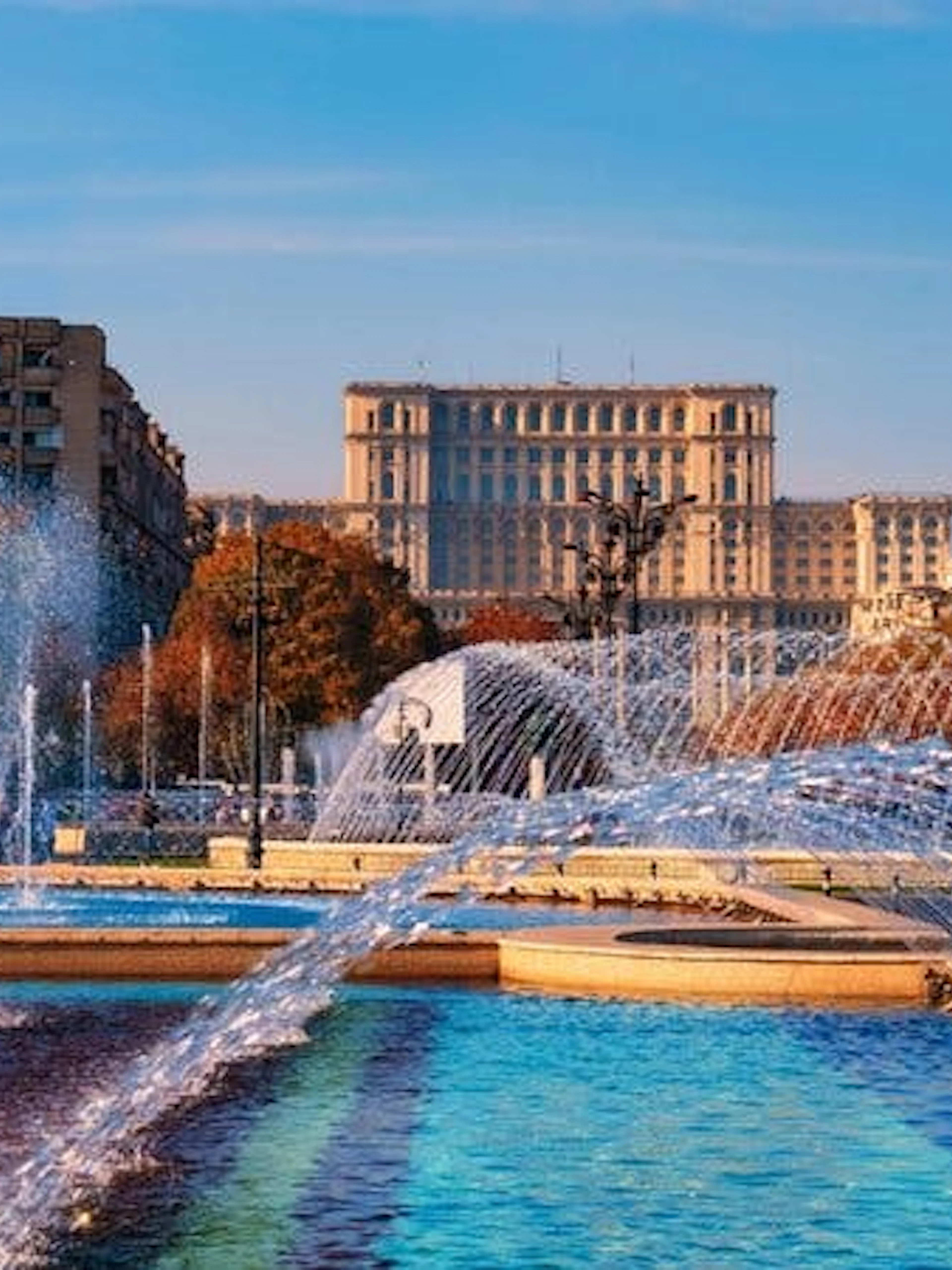 Fountains in front of the Palace of the Parliament, Bucharest, on a sunny day.