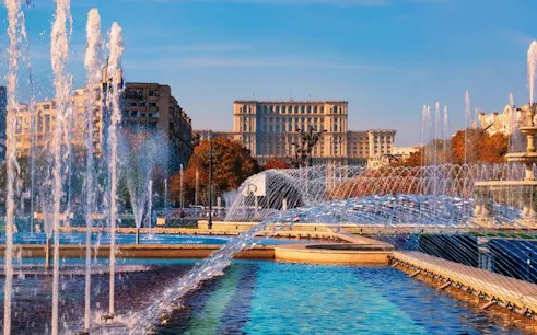 Fountains in front of the Palace of the Parliament, Bucharest, on a sunny day.