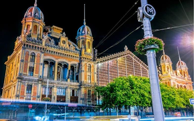 Historic Budapest building illuminated at night, part of the Ghosts of Budapest self-guided city exploration game.