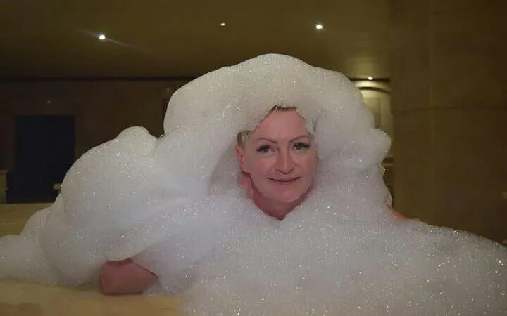 Person enjoying a bubble bath during a spa session in Hurghada.