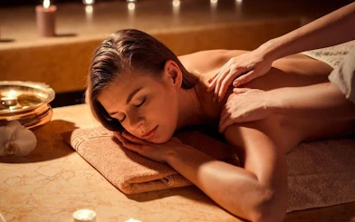 Turkish bath massage in Hurghada spa with candles and relaxing ambiance.