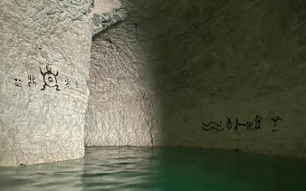Subterranean river with ancient petroglyphs in Punta Cana hidden cenote.