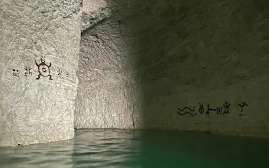 Subterranean river with ancient petroglyphs in Punta Cana hidden cenote.