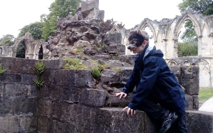 Person exploring medieval ruins during Harry Potter tour in York.