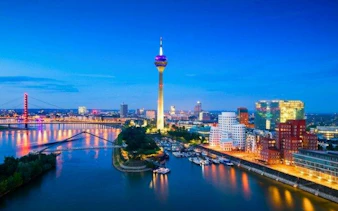 Düsseldorf skyline with Rhine Tower and Media Harbor at dusk.