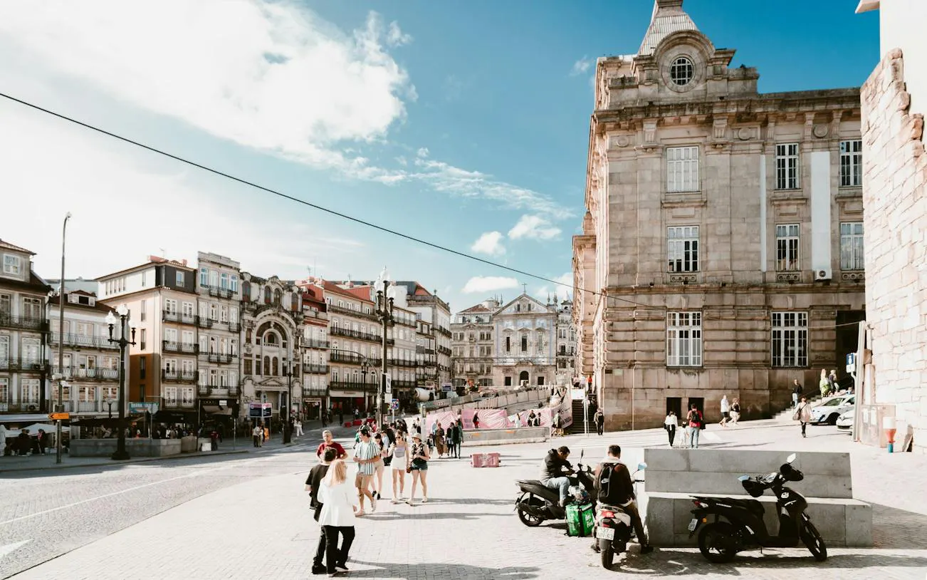 Porto Historic Center with people walking near historic buildings on a sunny day.