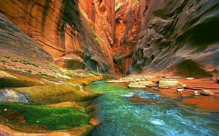 Blue Hole Canyon with flowing water and rocky walls, Sharm El Sheikh tour.