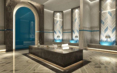 Turkish bath with marble interior, massage table, and steam bath in Hurghada spa.