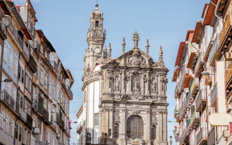 Baroque church facade in Porto city center on a sunny day.