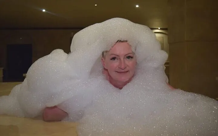 Person enjoying a foam bath in a Turkish bath, Sharm El Sheikh.