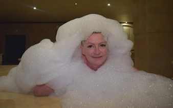Person enjoying a foam bath in a Turkish bath, Sharm El Sheikh.