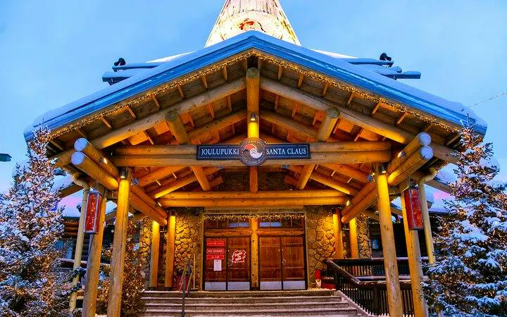 Santa Claus Village entrance with snow-covered roof in Rovaniemi, Finland.