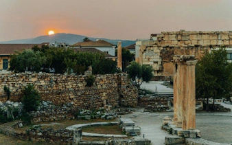Ancient ruins in Athens at sunset, part of a self-guided walking tour.