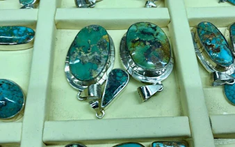 Turquoise jewelry displayed on a tray during Cappadocia local producer shopping tour.