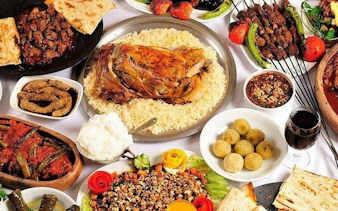 Traditional Turkish dishes with kebabs, rice, and vegetables on a cultural tour in Eastern Turkey.