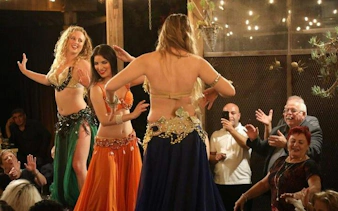Cabaret dancers performing at a night show with dinner in Hurghada.