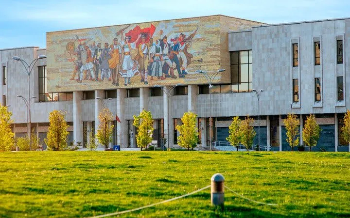 National History Museum in Tirana with mosaic mural, part of self-guided walking tour.