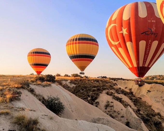 Cappadocia Camel Ride Tour with Sunrise Hot Air Balloon Views and Hotel Transfers