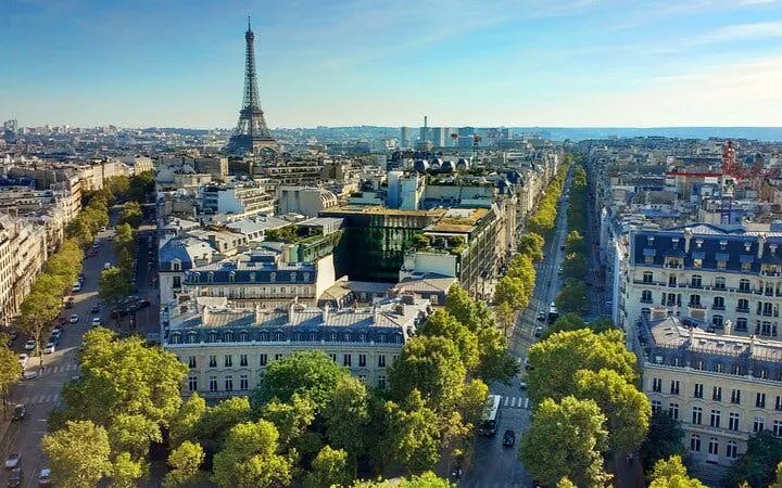 Aerial view of Paris with Eiffel Tower, part of Edith Piaf's self-guided city exploration game.