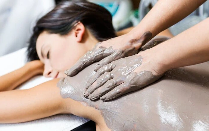 Moroccan hammam massage with clay treatment in Marrakesh spa.