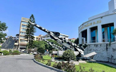 Hanoi museum with military aircraft display on motorbike tour route.