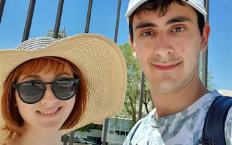 Two tourists enjoying a sunny day in Marseille during a self-guided city exploration game.