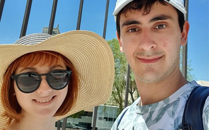 Two tourists enjoying a sunny day in Marseille during a self-guided city exploration game.
