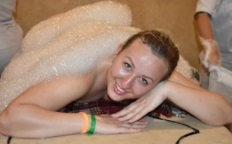 Person enjoying a foam massage in a Turkish bath, Hurghada.