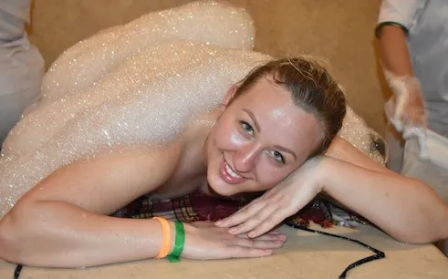 Person enjoying a foam massage in a Turkish bath, Hurghada.