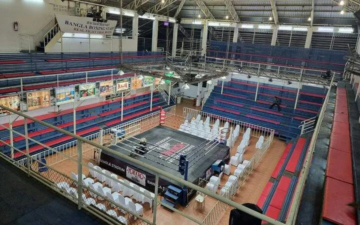 Bangla Boxing Stadium interior with Muay Thai ring and seating in Phuket, Thailand.