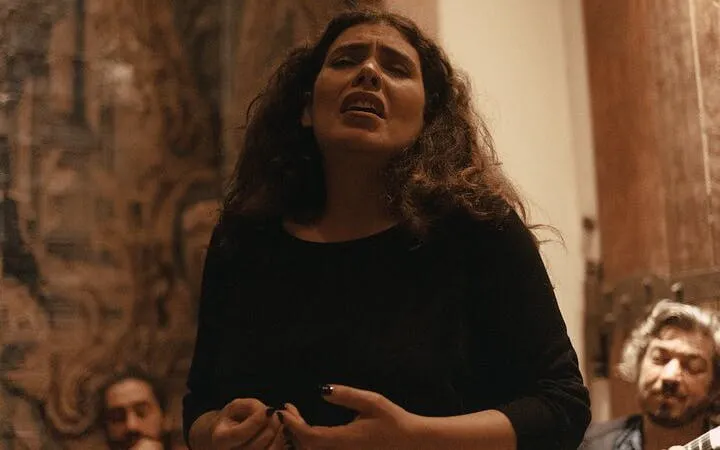 Singer performing at Fado Midnight Open Mic, Mesa de Frades, Lisbon.